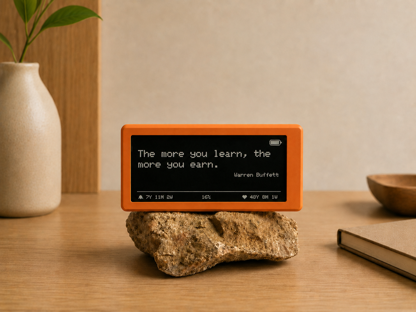 The Freedom Clock showing a motivational quote on its e-ink screen